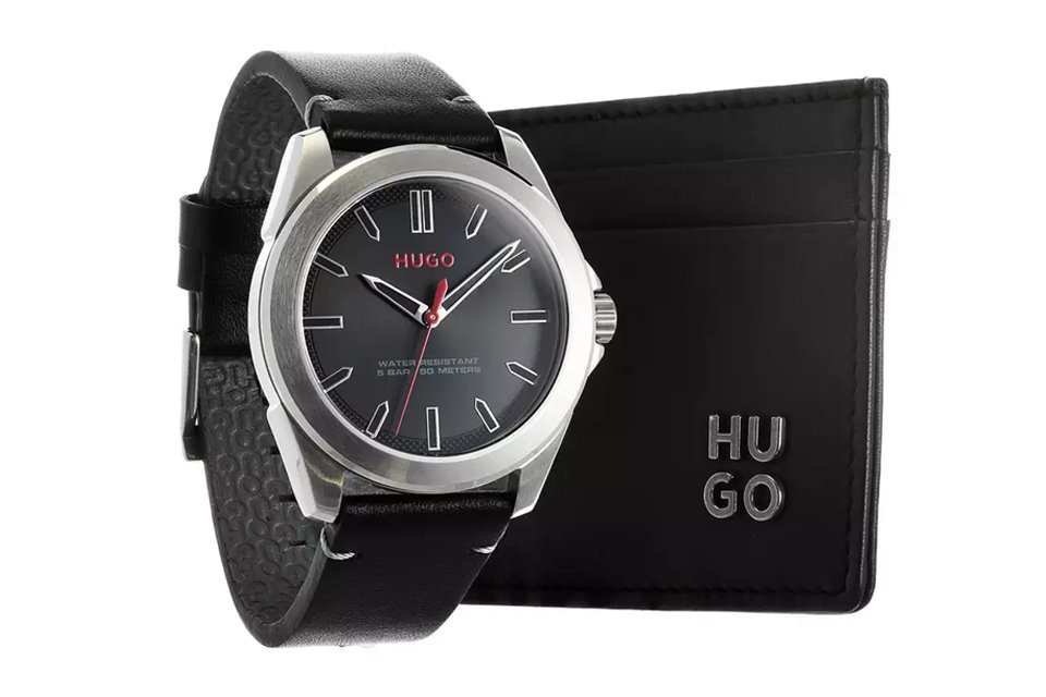 A Hugo gift set containing a men's black strap watch and a wallet.